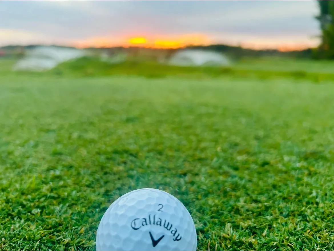 Lakes Area Links natural putting course golf ball at sunset